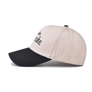 Close-up of diet coke embroidery on color-block cotton baseball cap with ventilation eyelets