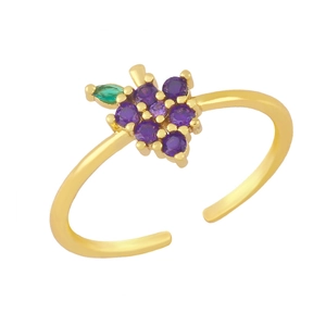 Detail of adjustable gold grape ring with purple cubic zirconia and green marquise leaf