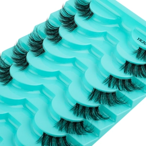 Detail view of 5 pairs of YK30 natural wispy half lashes on a green tray