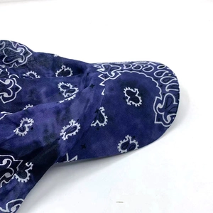 Detail view of navy blue bandana paisley pattern on lightweight cotton baseball cap