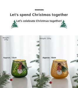Detail of green and gold hammer-textured glass candle holders with Santa decor