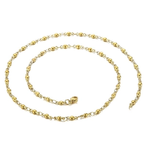 Collier minimaliste à chaîne à billes dorées en acier inoxydable sur fond blanc