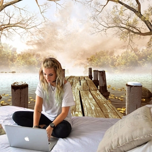 Detail of wall tapestry featuring autumn lake landscape with wooden bridge and mountains