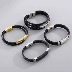 Men's minimalist black leather and titanium steel bracelets set with gold accents