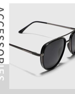 Detail of polarized aviator sunglasses showing matte frame and textured metal temples