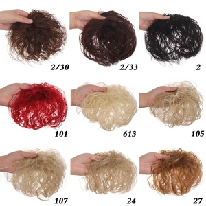 Detailed view of multi-color synthetic curly hair pieces and hair extensions for daily wear.