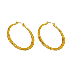 Minimalist textured gold hoop earrings with geometric stripes and secure clasp closure