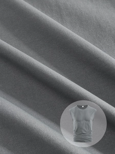 Macro shot of dark grey knit fabric texture with sleeveless shirt inset detail