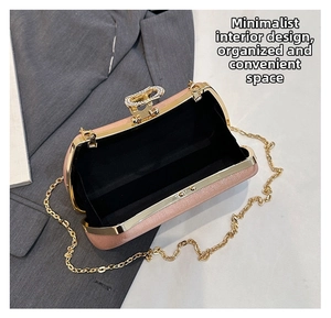 Detail of pink sequin clutch bag with crystal bow clasp and gold chain over suit jacket