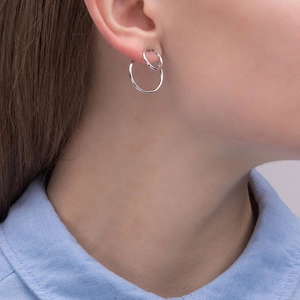 Elegant S925 sterling silver double hoop earrings with cubic zirconia on a model