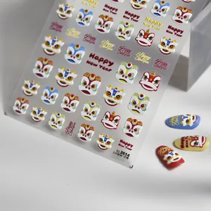 Macro detail of 3D embossed lion dance nail stickers with Happy New Year text
