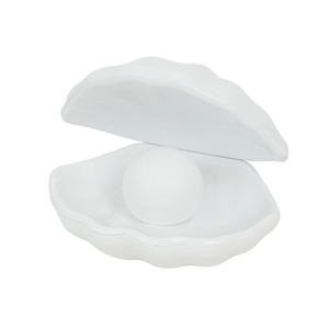 Minimalist white shell-shaped night light with a luminous pearl sphere on a clean background