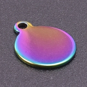 Macro shot of circular rainbow stainless steel pendant for DIY jewelry making necklaces