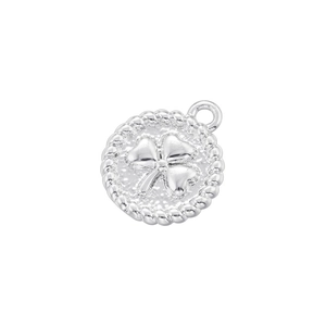 Macro shot of silver round clover pendant with embossed pattern and twisted rope edge