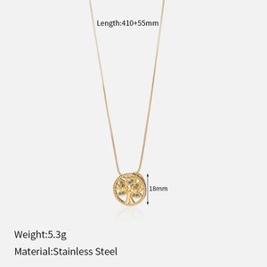 Detail showing 5.3g weight and 18mm tree of life pendant on a gold stainless steel chain