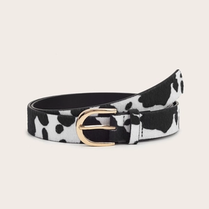 Women's faux calf hair belt with black and white cow print and gold D-ring buckle