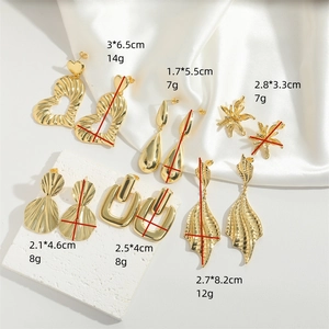 Collection of gold heart and leaf drop earrings with various size measurements