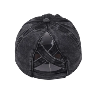 Detail view of the washed denim baseball cap featuring unique criss-cross ponytail elastic straps