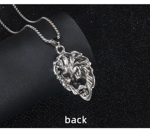 Close-up of the back structure and metallic texture of the lion head pendant
