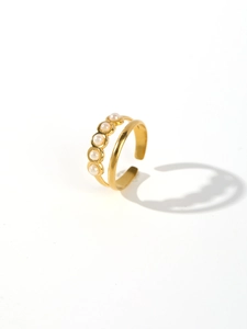 Detailed close-up of golden stainless steel ring featuring five elegant pearls on white background