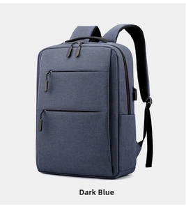 Detail view of the side USB charging port on the blue professional business laptop backpack