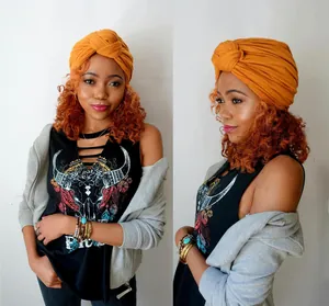 Front and side view of ginger yellow turban wrap with elegant knot design for women