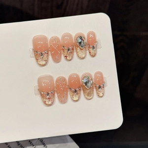 Pink gradient press-on nails with gold glitter, pearls and luxury rhinestones set