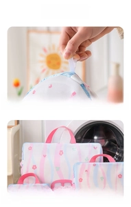 Detail of 3cm wide pink handle strap on floral mesh laundry bag set for washer