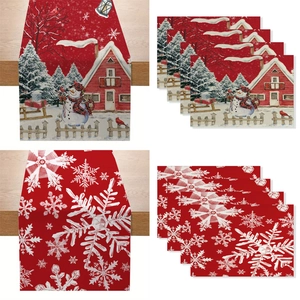 Christmas table runner and placemat set featuring snowman and snowflake holiday designs