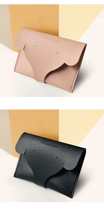 Détail de porte-cartes en cuir PU en forme d'éléphant rose et noir avec texture litchi