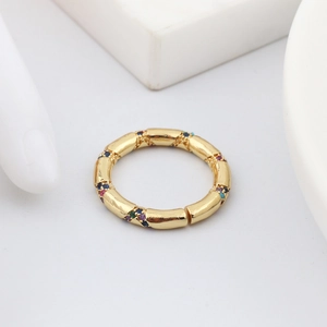 Detailed view of snake-shaped golden ring with multi-color micro-pave crystals