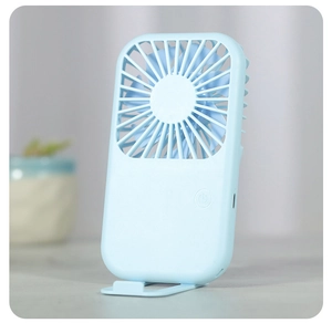 Detail of light blue mini fan with USB port, matte finish and foldable desk stand