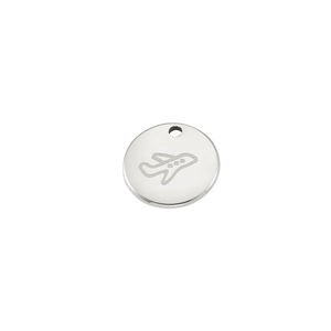 Macro detail of a mirror polished 18K gold stainless steel round charm with airplane engraving