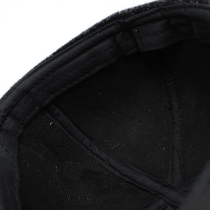 Detailed interior view showing cross-stitched sweatband and lining of the warm winter cap