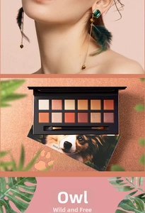 Macro view of 12-color jungle eyeshadow palette featuring warm orange and earth tones