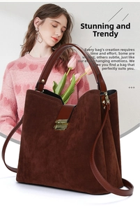 Close-up of dark brown suede tote bag with golden metal buckle and leather handle