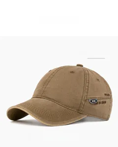 Detail of khaki cotton baseball cap showing side embroidery and design rubber tag