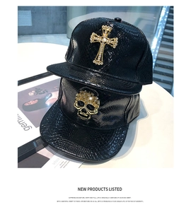 Detail of black faux leather snake pattern hip-hop hats with rhinestone cross and skull
