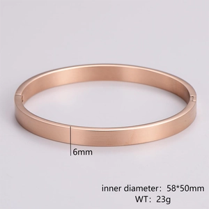 Detail of rose gold brushed metal bangle showing 6mm width and 58x50mm inner diameter