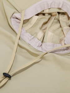 Detail view of khaki sun hat featuring breathable mesh lining and adjustable wind rope