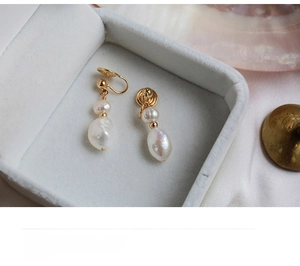 Detail of baroque freshwater pearl clip-on earrings in a premium jewelry box