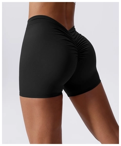Close-up of black high-waisted yoga shorts with ruched back lifting detail for women