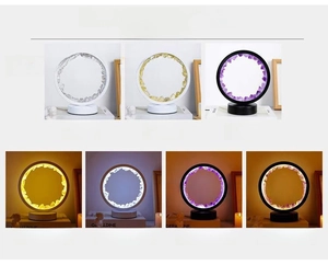 Comparison of amethyst and citrine crystal ring lamps with warm and cool lighting effects