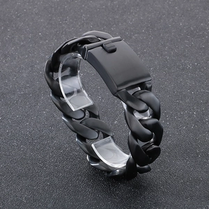 Macro view of 24mm wide black polished stainless steel Cuban chain bracelet with box clasp