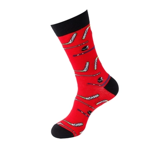 Detail of red crew socks with black hockey stick and puck patterns in a knit blend