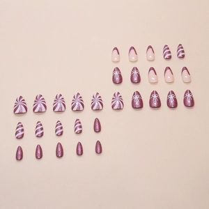 Purple glitter Christmas press-on nails with white festive bows and candy stripes
