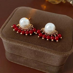 French vintage earrings with large white pearl and red beaded tassel on brown velvet box