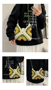 Detail view of handmade crochet sunflower shoulder bag with intricate granny square patterns
