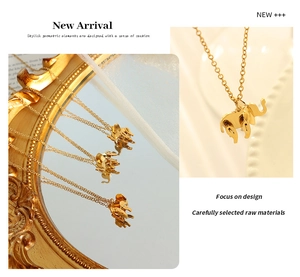 Detail of 18K gold plated elephant pendant with geometric design and vintage mirror reflex