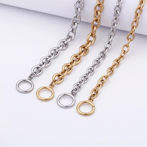 Golden and silver stainless steel O-link necklaces with OT toggle clasps on white background